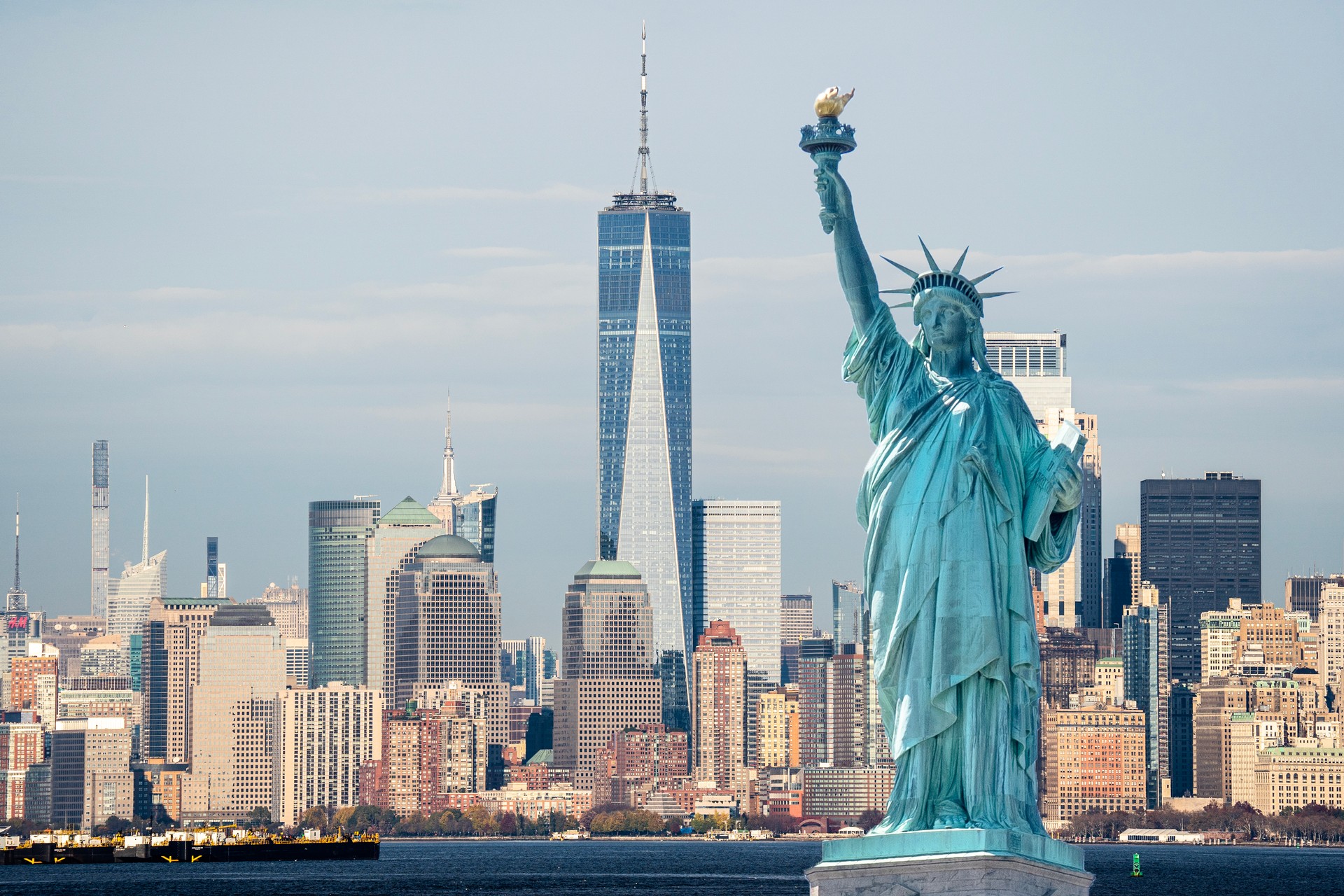 Statue Liberty on background of Manhattan during a good day. Statue Liberty opposite New York city